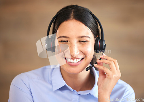 Image of Happy woman, face and headset at callcenter, contact us and customer service agent with smile. CRM, phone call and tech support with telecom, female consultant smile with help desk and communication