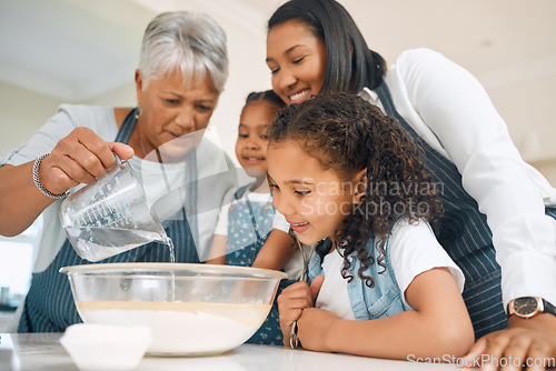 Image of Grandmother, mom or children in kitchen to bake as a happy family with siblings learning cookies recipe. Mixing cake, development or grandma smiling or teaching young kids baking by pouring water