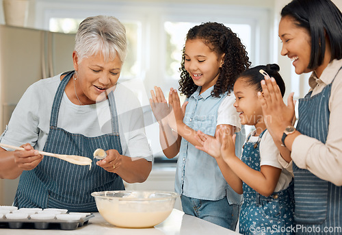 Image of Applause for grandmother, mom or happy kids baking in kitchen as a family with young siblings learning. Mixing cake, grandma or excited parent smiling, clapping or teaching girls to bake with flour
