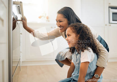 Image of Mother, oven or child baking in kitchen as a happy family with young girl learning cookies recipe. Cake, wait or mom smiling, helping or teaching daughter to bake with a smile for development at home