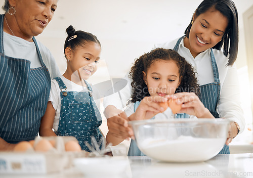 Image of Grandmother, mom or kids baking in kitchen as a happy family with young girl learning cookies recipe. Mixing cake, parent or grandma smiling or teaching children to bake with eggs for development