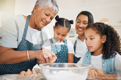 Image of Grandmother teaching, mom or kids baking in kitchen as a happy family with young girl learning a recipe. Mixing cake, parent or grandma smiling or helping children to bake with eggs for development