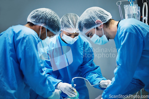 Image of Team of doctors n surgery, health and surgical procedure start with PPE and collaboration in operation theatre in hospital. Medical, healthcare insurance and safety gear with surgeon people in clinic