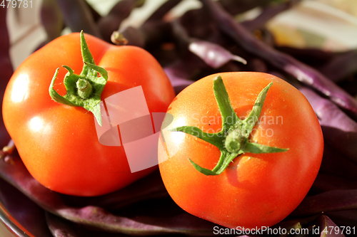 Image of red tomatoes and blue haricots