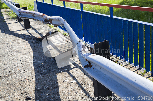 Image of old metal barrier after the accident