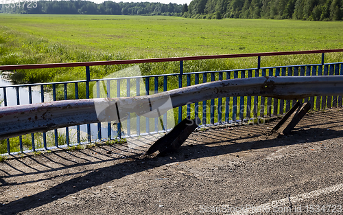 Image of old metal barrier after the accident