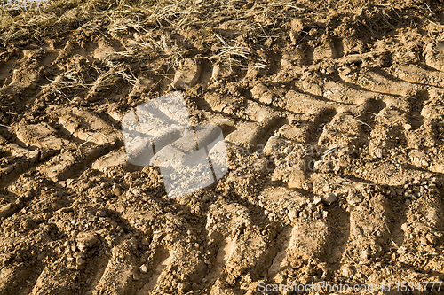 Image of tire tracks on the sand