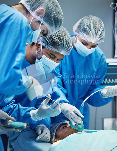 Image of Group of doctors in surgery, medicine and surgical procedure start with PPE and team in theatre in hospital. Medical operation, health insurance and safety gear with surgeon people and healthcare