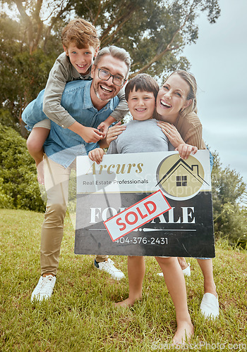 Image of Parents, kids and property with sold sign, portrait and smile for new home, start and investment for future. Father, mother and boy children with sale poster, real estate investing and family house