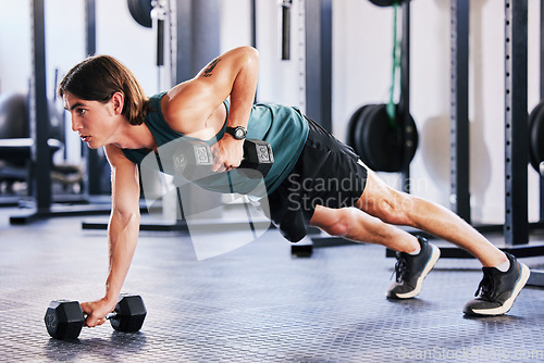 Image of Fitness, dumbbell and push up with a man at gym for a workout, biceps exercise or training. Male athlete person with iron weights for strong muscle, focus and agile performance at wellness club