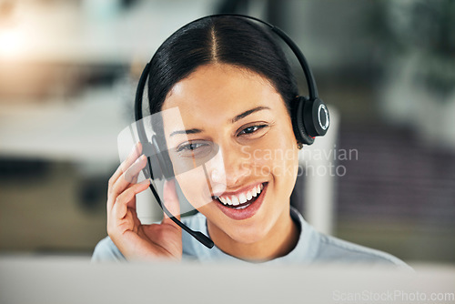 Image of Happy woman, call center and face with a headset at computer for customer service or sales. Smile of a consultant person talking at a pc with a microphone for telemarketing, crm or help desk support