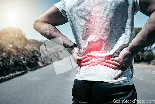 Image of Fitness, back pain and injury with a sports man holding his sore body while outdoor for a workout. Exercise, anatomy and accident with a male athlete feeling tender while training or running alone