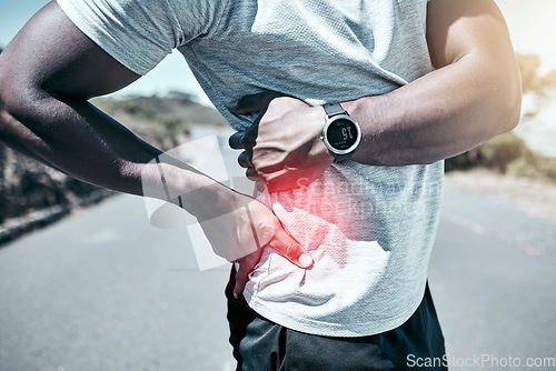 Image of Exercise, back pain and injury with a sports man holding his sore body while outdoor for a workout. Fitness, anatomy and accident with a male athlete feeling tender while training for a cardio run