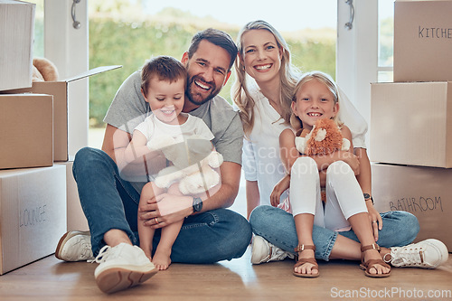 Image of Portrait, happy family and kids on floor of new home, real estate and property loan for relocation. Children, parents and moving in together for building investment, mortgage and boxes in apartment