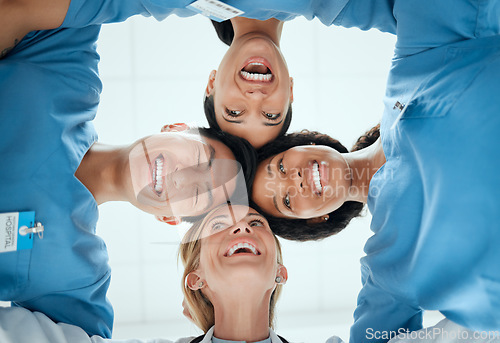 Image of Smile, teamwork or faces of doctors in huddle laughing in collaboration together for healthcare goals. Low angle, funny team building or happy medical nurses with group support, motivation or mission