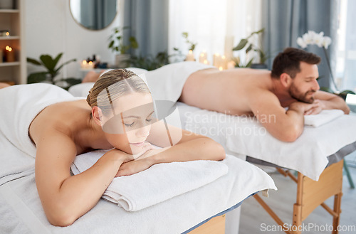 Image of Massage, calm and peaceful couple lying in spa for wellness treatment or at a luxury resort or vacation. Bed, zen and relaxing partners indoors or stress relief or physical therapy and body care