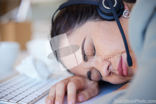 Image of Woman, sleeping and tired at the call center desk, office or working late in customer support, service or consulting. Sleep, rest and burnout in telemarketing, crm or sales job and mental health