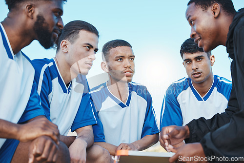 Image of Sports, soccer coach and a team talking on a field for fitness exercise or outdoor game. Football formation, club and diversity athlete men listen to plan for coaching, scrum and training strategy