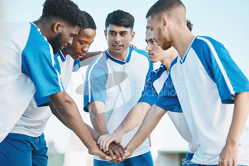 Image of Hands together, sports group and soccer team on field for fitness training or competition. Football player, club and diversity athlete men in solidarity for motivation, game scrum or teamwork outdoor