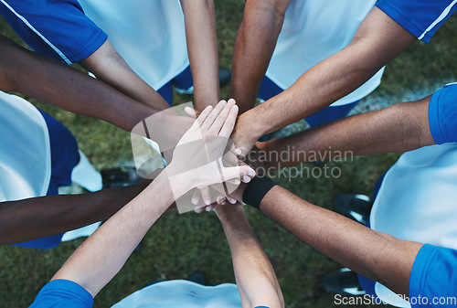 Image of Hands stacked, above and men on a soccer field for support, motivation and team spirit. Sports, training and athlete football players with a gesture for celebration, solidarity and trust at a game