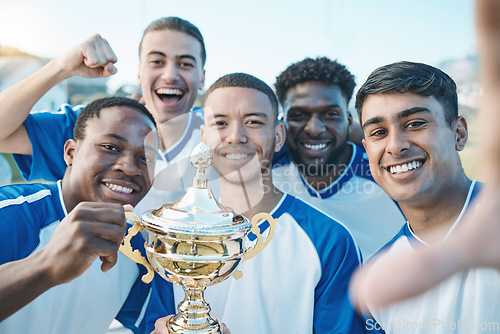 Image of Sports group, soccer trophy and selfie of team on field for game award or prize outdoor. Football player, club and diversity champion men portrait for sport competition win, success and achievement