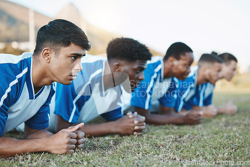 Image of Sports group, soccer and team plank on field for fitness training, workout or exercise outdoor. Football player, club and diversity athlete men with focus for strong competition or sport challenge