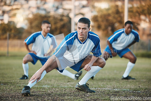Image of Sports group, soccer and team stretching on field for fitness training or game outdoor. Football player, club and athlete people with focus for sport competition, legs workout or warm up challenge