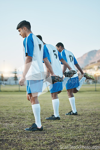 Image of Sports group, soccer and team stretching legs on field for fitness training or muscle warm up. Football player, club and diversity athlete people with focus on sport competition, workout or challenge