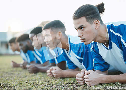 Image of Plank, sports group and soccer team on field for fitness training, workout or exercise outdoor. Football player, club and face of athlete people with strong focus for sport competition or challenge