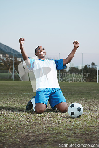 Image of Soccer ball, sports and man celebrate goal on field for competition, fitness or training outdoor. Black male athlete football player, pitch and game celebration for sport achievement, success or win