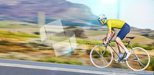 Image of Fast, fitness and a man cycling on the road for cardio, sports or marathon training on a bike. Focus, exercise and a moving cyclist on bicycle for a challenge, triathlon or competition in the street