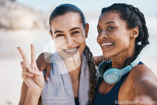 Image of Women friends, beach selfie and peace sign in portrait for exercise, health or hug with fitness in nature. Latino girl, black woman and photography for profile picture, social network and blog update