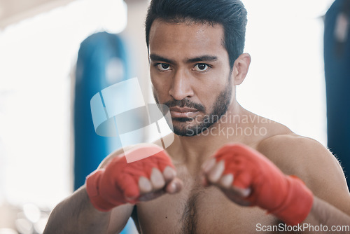 Image of Sports, boxing and portrait of man in gym for training, workout and exercise for mma fighting. Fitness, body builder and face of serious male athlete ready for boxer competition, practice and punch