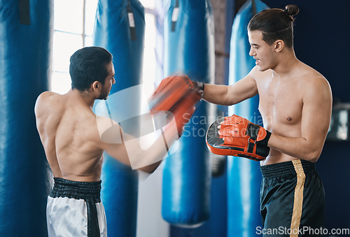 Image of Sports, boxing and man with coach in gym for training, workout and exercise for mma. Fitness, body builder and male athlete with personal trainer for boxer competition, practice match and fighting