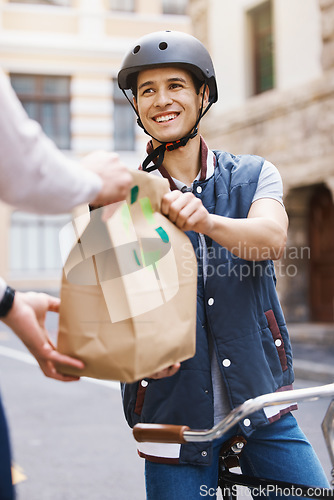 Image of Man, delivery bicycle and smile with bag, order or e commerce for food, product or sustainable transport. Young guy, bike and cbd street for customer experience, chat or eco friendly at logistics job