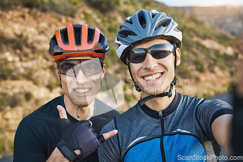 Image of Men, cycling friends and nature selfie for race, training or shaka sign with smile in outdoor portrait. Man, mountains and exercise partnership with photography, profile picture or social network app