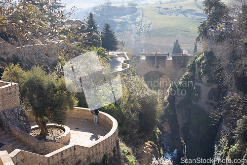 Image of Panoramic view of hanging gardens of Cuenca over El Tajo Gorge with whitewashed houses of Ronda, Andalusia, Spain.