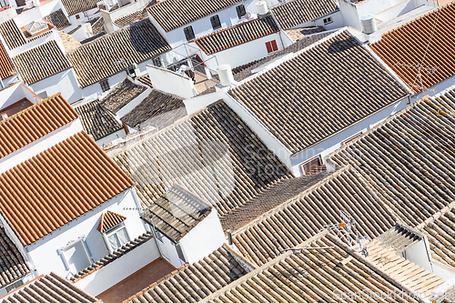 Image of Aerial panoramic view of rooftops of white houses of Olvera town, considered the gate of white towns route in the province of Cadiz, Spain