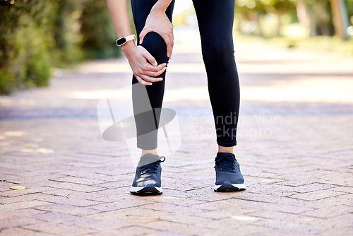 Image of Closeup, outdoor and woman with exercise, knee pain and workout with health issue, muscle strain and inflammation. Zoom, female person and athlete outside, leg injury and training with broken bone