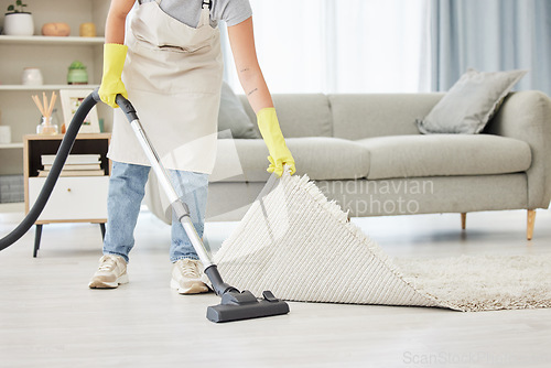 Image of Carpet, person and vacuum with cleaner, home and remove dust for hygiene, bacteria and lounge. Dirt, worker and maid with cleaning equipment, mat and apartment with housekeeping and spring cleaning