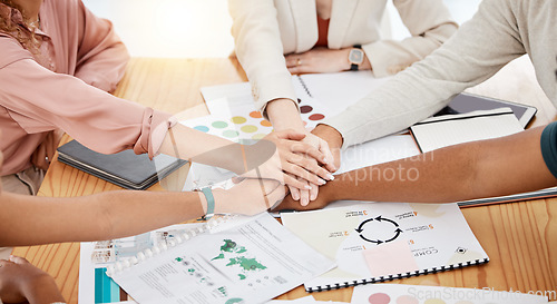 Image of Hands stacked, business and creative people for brand development, project goals and teamwork on documents. Together sign, meeting and graphic designer, marketing agency or person in collaboration
