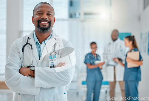 Image of Happy, doctor and portrait of black man with crossed arms for medical help, insurance and trust. Healthcare, hospital team and face of professional male health worker for service, consulting and care