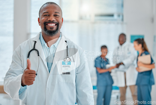 Image of Thumbs up, doctor and portrait of black man with smile for medical help, insurance and trust in hospital. Healthcare, thank you sign and face of male health worker for service, consulting and care