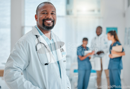 Image of Happy, doctor and portrait of black man in hospital for medical help, insurance and trust. Healthcare, clinic team and face of professional male health worker smile for service, consulting and care