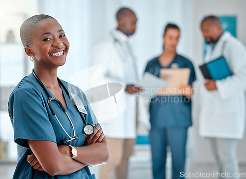 Image of Hospital, happy doctor and portrait of black woman for medical care, insurance and wellness. Healthcare, clinic nurse or face of female health worker with crossed arms for service, consulting or help
