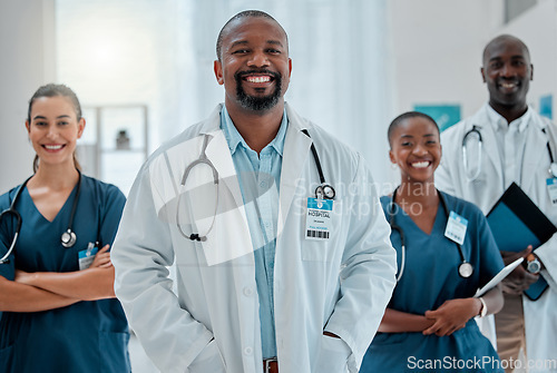 Image of Teamwork, happy and portrait of doctors in hospital for medical help, insurance and service. Healthcare, collaboration and men and women health workers smile in clinic for help, consulting and care