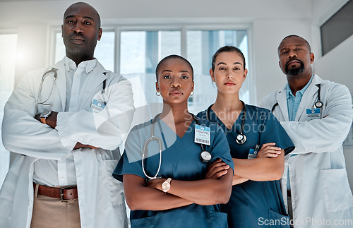 Image of Group, doctors and portrait with arms crossed, hospital or teamwork for solidarity, women and men for healthcare. Nurses, team and people with diversity, medical collaboration and serious in clinic