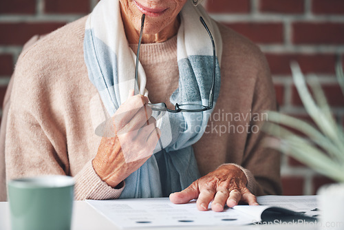 Image of Mature woman, reading and document in the indoor with closeup and glasses in hand with application. Retirement, information and female person, read for investment or budget with a contract at cafe.