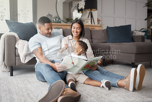 Image of Mother, father and happy child reading books on living room floor for educational fun, learning and development at home. Family, parents and storytelling with boy kid for love, care or play in lounge