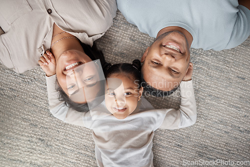 Image of Top view, parents and happy portrait of kid for love, care and bonding for quality time together at home. Face of mom, dad and happiness of girl child, family and relax in house for fun, joy and play